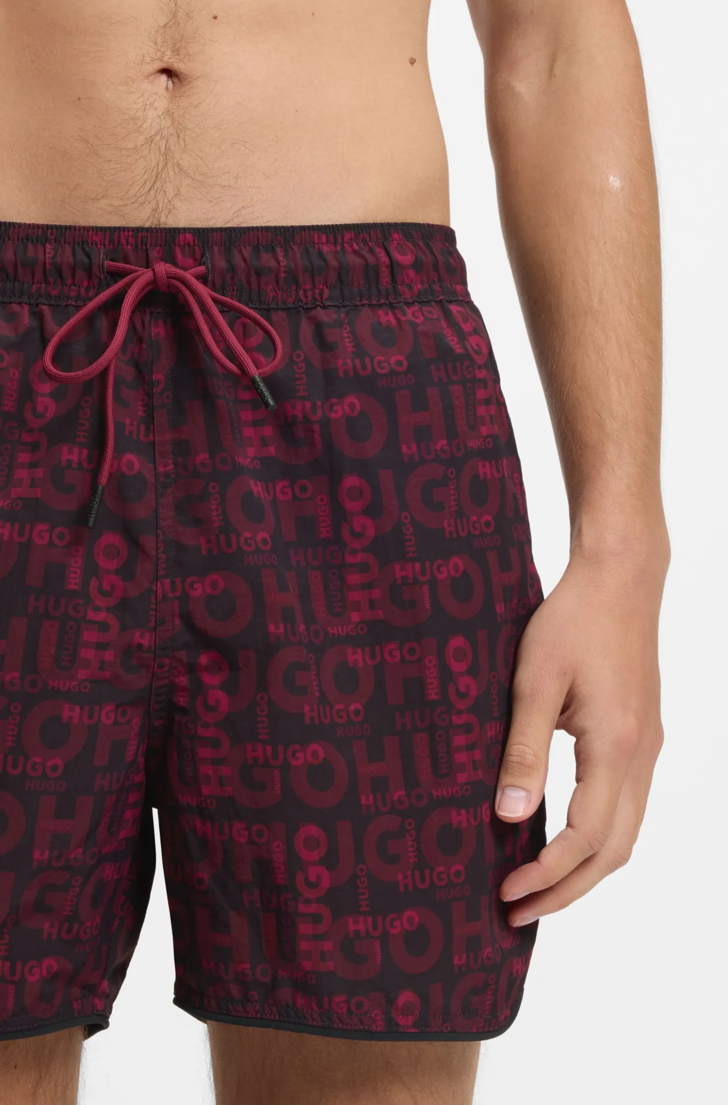 Badeshorts mit saisonalem Print und abgerundetem Saum