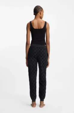 Jogginghose aus Baumwoll-Mix mit Allover-Logo-Muster