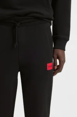 Jogginghose aus Baumwoll-Terry mit rotem Logo-Label