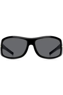 Schwarze Sonnenbrille im Masken-Stil mit goldfarbenen Metalldetails