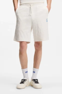 Shorts aus Baumwoll-Frottee mit Leopard-Jacquard